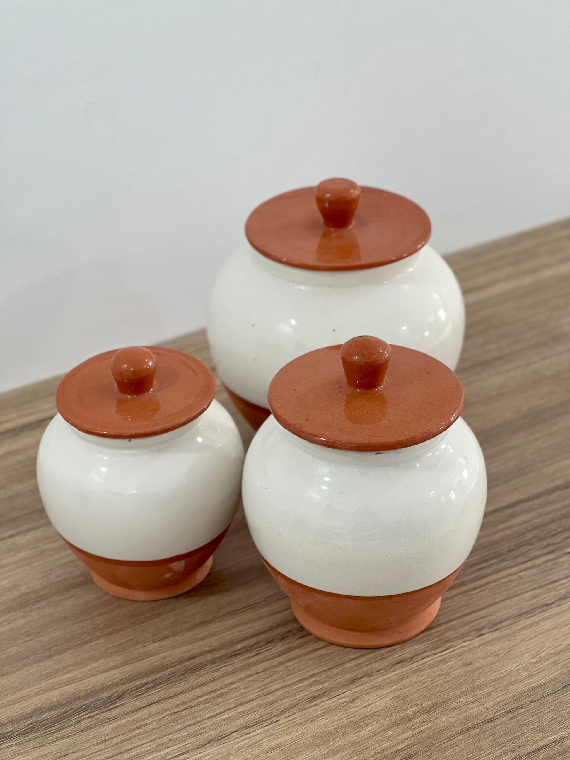 Handcrafted Pottery Kitchen Canisters, Set of 3 Elegant Storage Jars with Unique Half-White and Half-Natural Finish.
